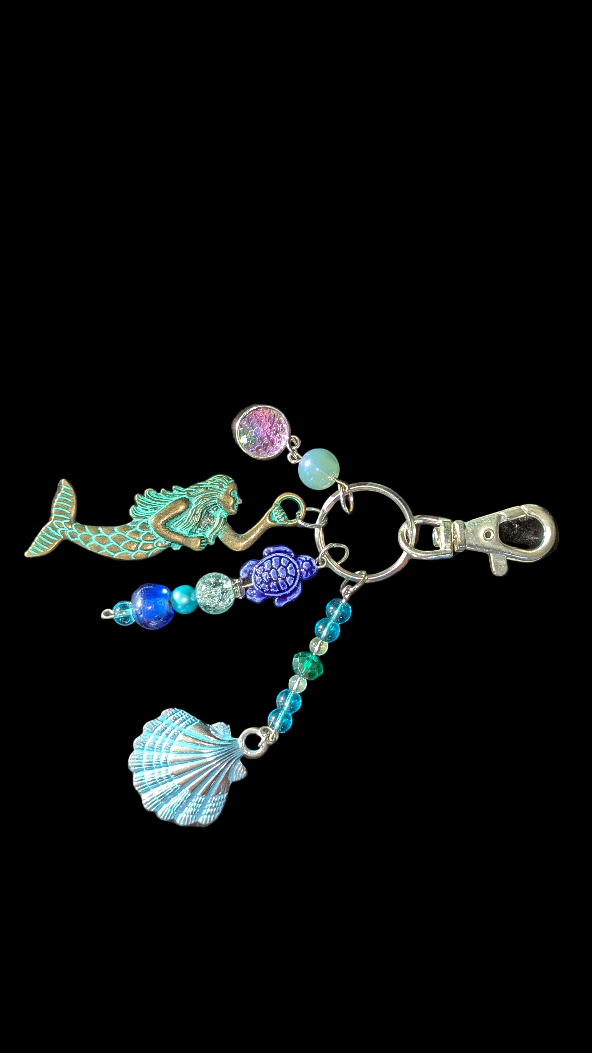 Keychain with mermaid, shell, and turtle charms.